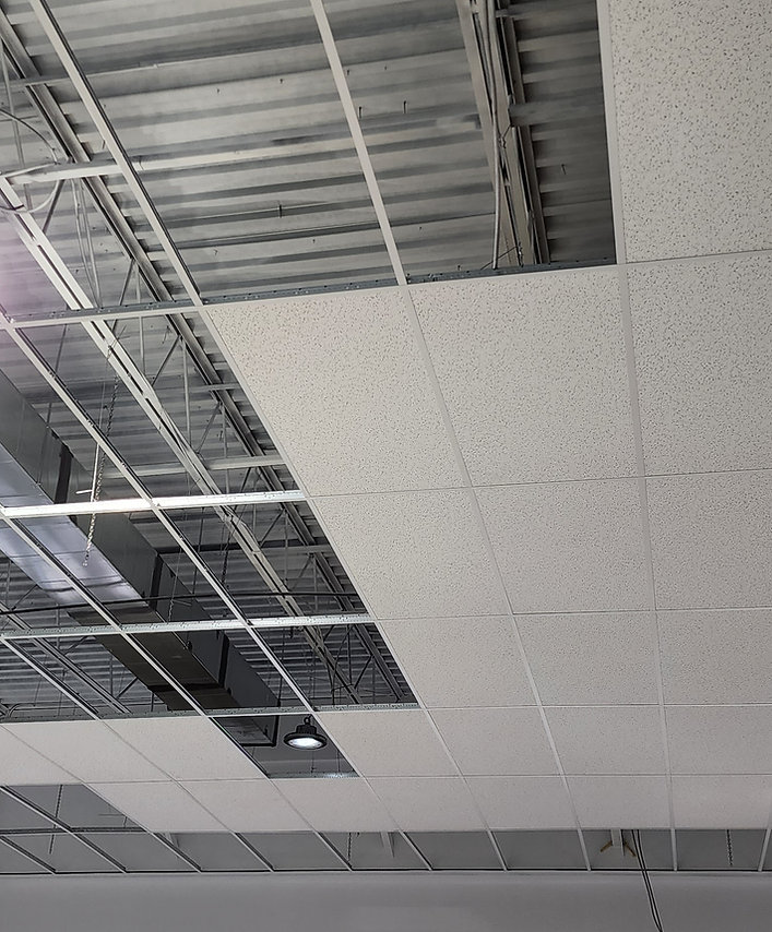 Acoustical ceiling tiles and suspended T-bar grid at Dollarama
